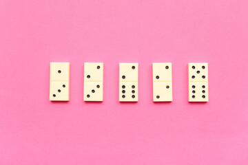 White dominos blocks on pink background