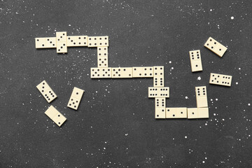 White dominos blocks on black grunge background
