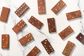 Wooden dominos blocks on marble background