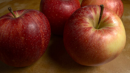 Group of Gala apples on a wooden table