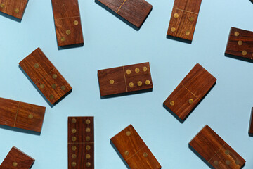 Wooden dominos blocks on blue background