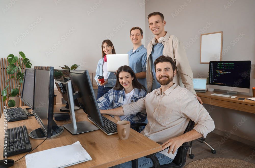 Wall mural team of programmers working in office