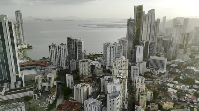 Drone flies from downtown toward the Panama Bay and the Casco Viejo at sunset in Panama City