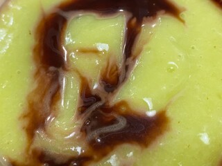 The texture of blended avocado juice, which is then mixed with chocolate milk.