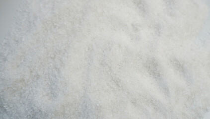 Large-crystal sea salt close-up. The texture of coarse-grained sea salt, taken in close-up. The white color and natural composition are ideal for use in cooking, cosmetics and home care.