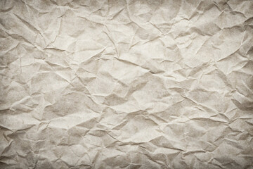 Obraz premium Crumpled beige paper texture background; design element