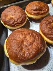 Photo of doughnuts fried in oil. Delicious.