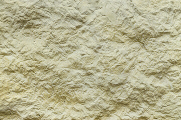 Yellow concrete texture as background, closeup