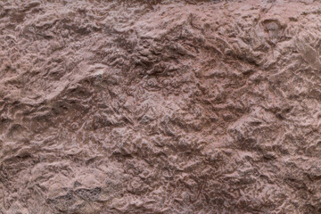 Brown concrete texture as background, closeup