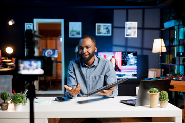 Internet star being sponsored by partnering brand to do mechanical keyboard unboxing content. Tech...