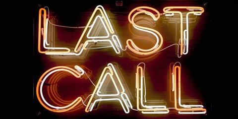 Bright neon sign reading 'LAST CALL' illuminated in vibrant colors against a dark background