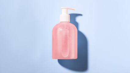 Mockup Jar with dispenser for soap, lotion, beauty care products on blue background