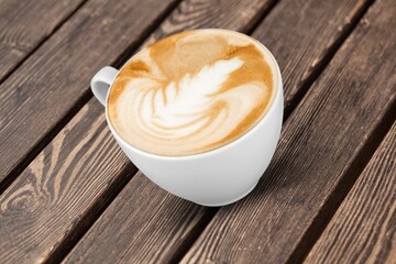 Coffee Mug with aroma Beans on desk Background