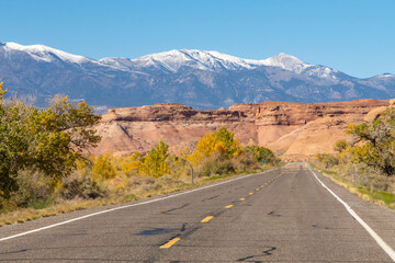 USA, Utah, Glen Canyon National Recreation Area. Road and Henry Mountains with fresh snow.