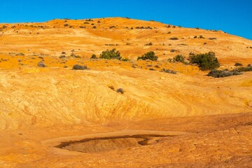 USA, Utah, Grand Staircase Escalante National Monument. Pothole filled with water after rain.