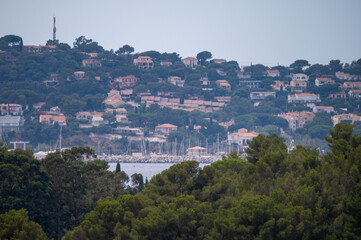 Obraz premium Landscape of French Riviera, view on hills, houses and green vineyards Cotes de Provence, production of rose wine near Saint-Tropez and Pampelonne beach, Var, France
