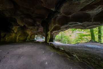 Scenic diversity of Mullerthal, Luxembourg's Little Switzerland, hiking routes, rock formations, moss-covered forests, tourist destination in Europe
