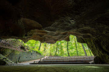Scenic diversity of Mullerthal, Luxembourg's Little Switzerland, hiking routes, rock formations, moss-covered forests, tourist destination in Europe