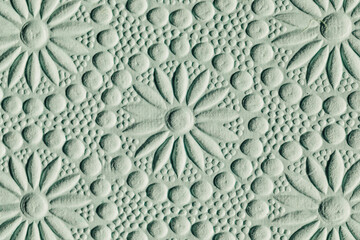 abstract embossed paper floral pattern in seafoam green