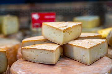 Farmer shop in Biarritz, France, Basque Country and Pyrenees sheep, cow and goat cheeses for sale, Tomme, Fermier Brebis, farmers cheese, close up