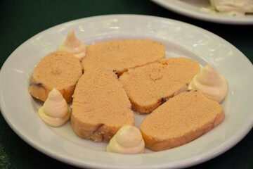 Traditional andalusian dish fish eggs seafood served with mayonnaise sauses in old tavern as tapa, Sanlucar de Barrameda, Spain