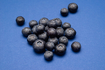 Fresh Blueberries on a blue background