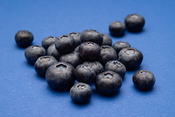 Fresh Blueberries on a blue background
