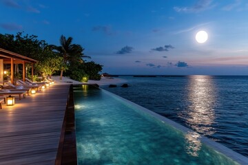 A captivating view of a serene moonlit pool beside a tranquil ocean, with palm trees and cozy lanterns creating an enchanting atmosphere at a tropical resort.