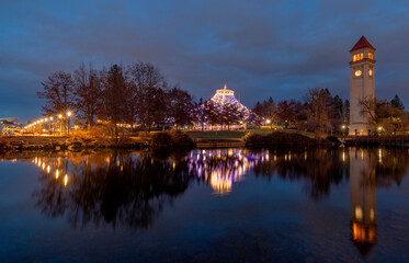 Fototapeta premium Great Northern Clocktower and The U.S. Pavilion from Expo 74 reflect in Riverside Park in Spokane, Washington State, USA.