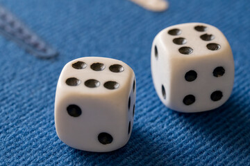 Closeup dices on a blue backgammon board