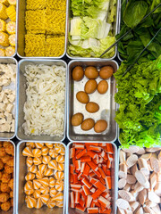 Shabu-shabu or sukiyaki. Beef slice on top of hot pot Fresh beef slices. Top view