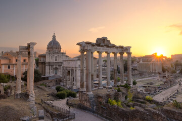 Naklejka premium Sunrise over the Roman Forum and archaeological zone encompassing the ancient site. Rome, Italy