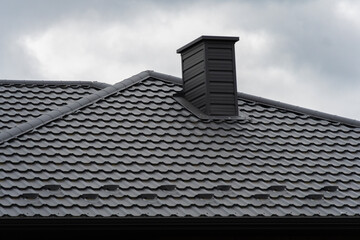 Modern black metal roofing, giving a building a strict appearance