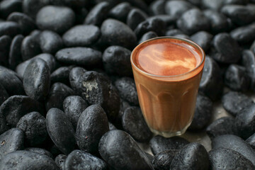 Hot latte coffee on black rock floor. Breakfast beverage morning concept. Coffee shop at the cafe.