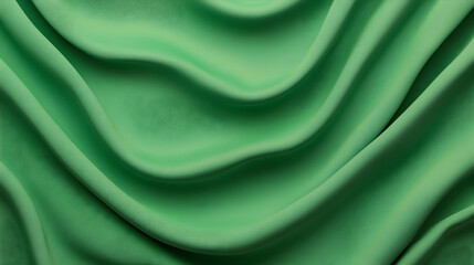 Obraz premium Soft green fabric drapes elegantly, creating flowing waves. Perfect for background textures or fashion websites