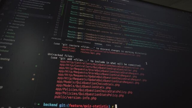 A close-up view of a terminal running the Git status command, displaying modified and newly added files. The screen highlights changes in a development environment.