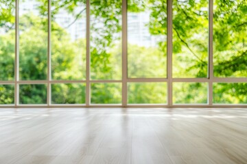 Fototapeta premium A bright, spacious room with large windows showcasing lush greenery outside, creating a serene and inviting atmosphere.