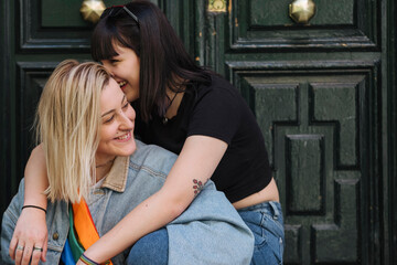 Lesbian couple sharing intimate moment, embracing love and affection