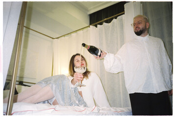 Couple Celebrating with Champagne in Luxurious Setting