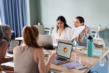 Group of women working and having fun in the office.