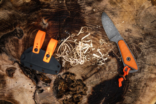 Close up shot of  wood shavings and knife.