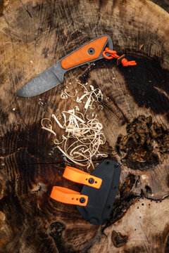 Close up shot of  wood shavings and knife.