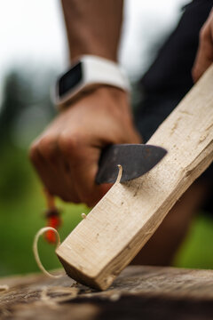 Close up shot of hands and knife.