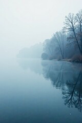 Fototapeta premium misty fog rising from the surface of a frozen lake, calm, ripples