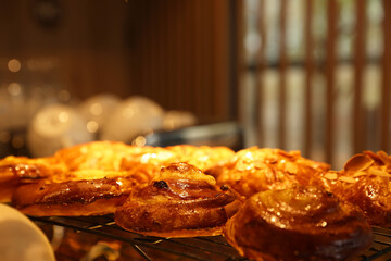 Delicious sweet roll buns on display in cafe, closeup