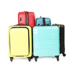 Many closed colorful suitcases isolated on white