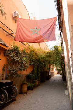 Street in Morocco with Moroccan flag on the wall