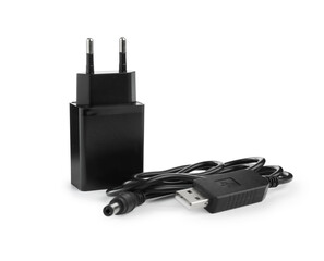 Black USB power adapter and charge cable isolated on white