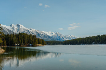 Frozen lake in Banff National Park on the background of mountains