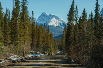 Scenic view of road to snowcapped mountains in  Canada 